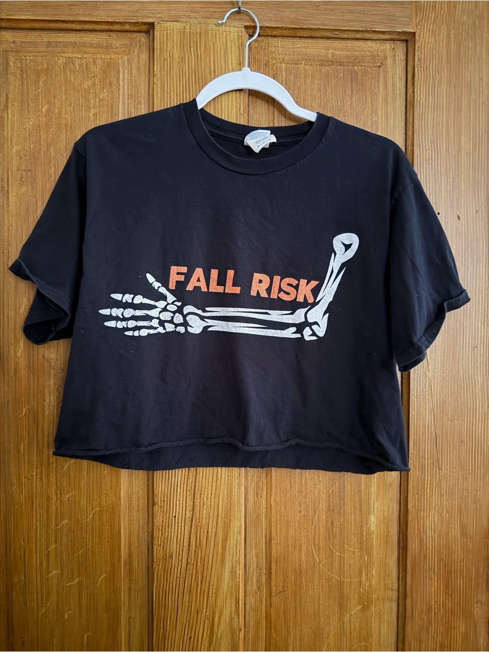 Fall Risk Skeleton Arm Black Cropped Graphic Tee Halloween M